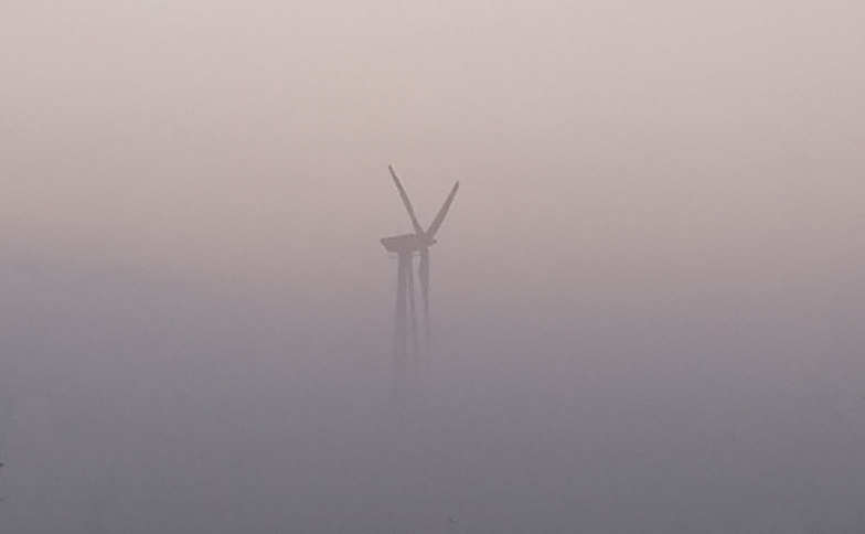 Wind turbine in fog